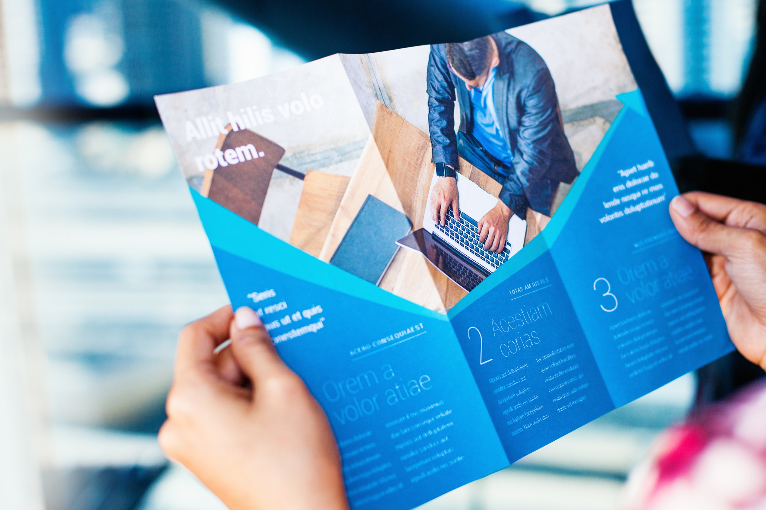 Hands holding a business brochures 1